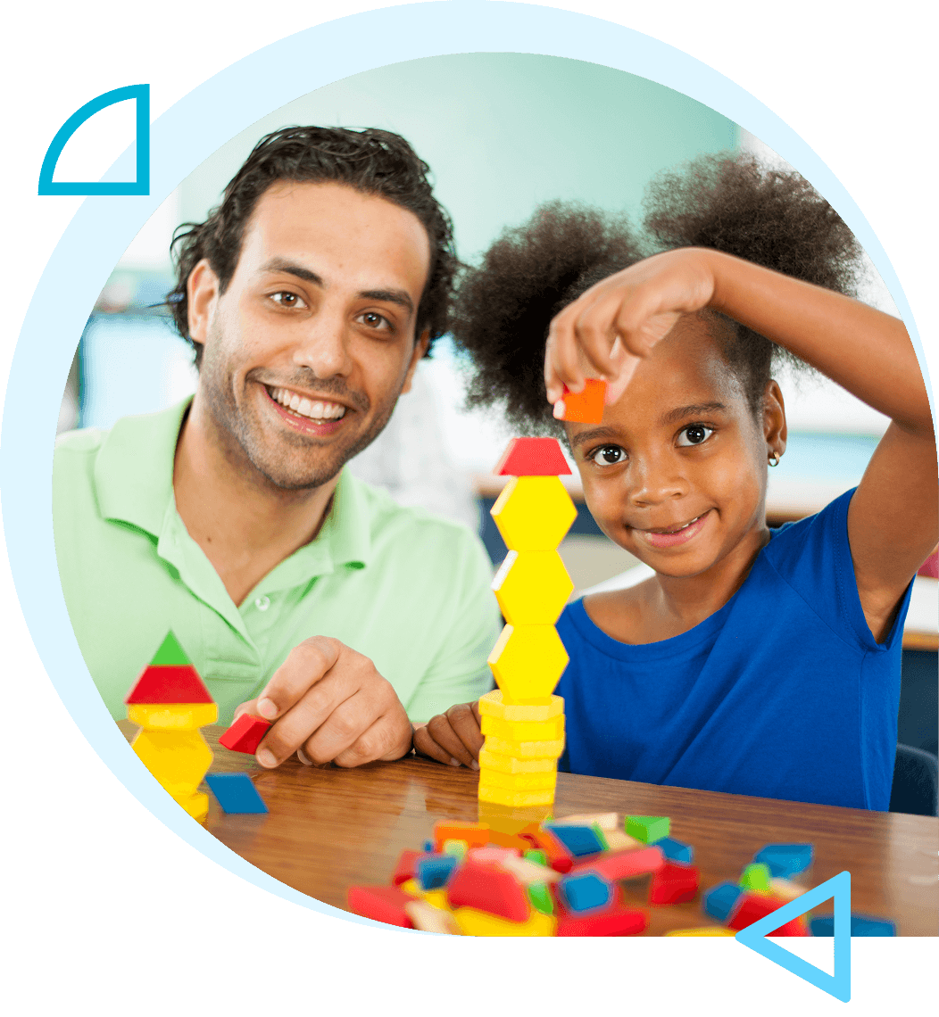 A man and a child playing with colorful blocks.